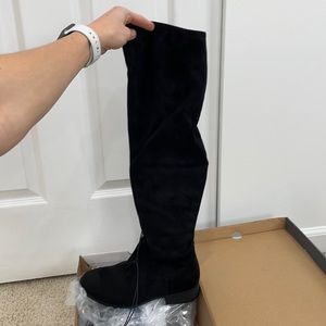Black thigh high boot